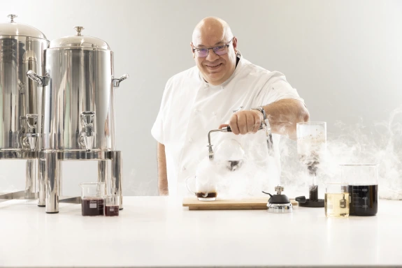 Chef Omo brewing coffee
